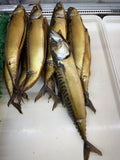 Golden smoked mackerel — skumbriya — on a tray